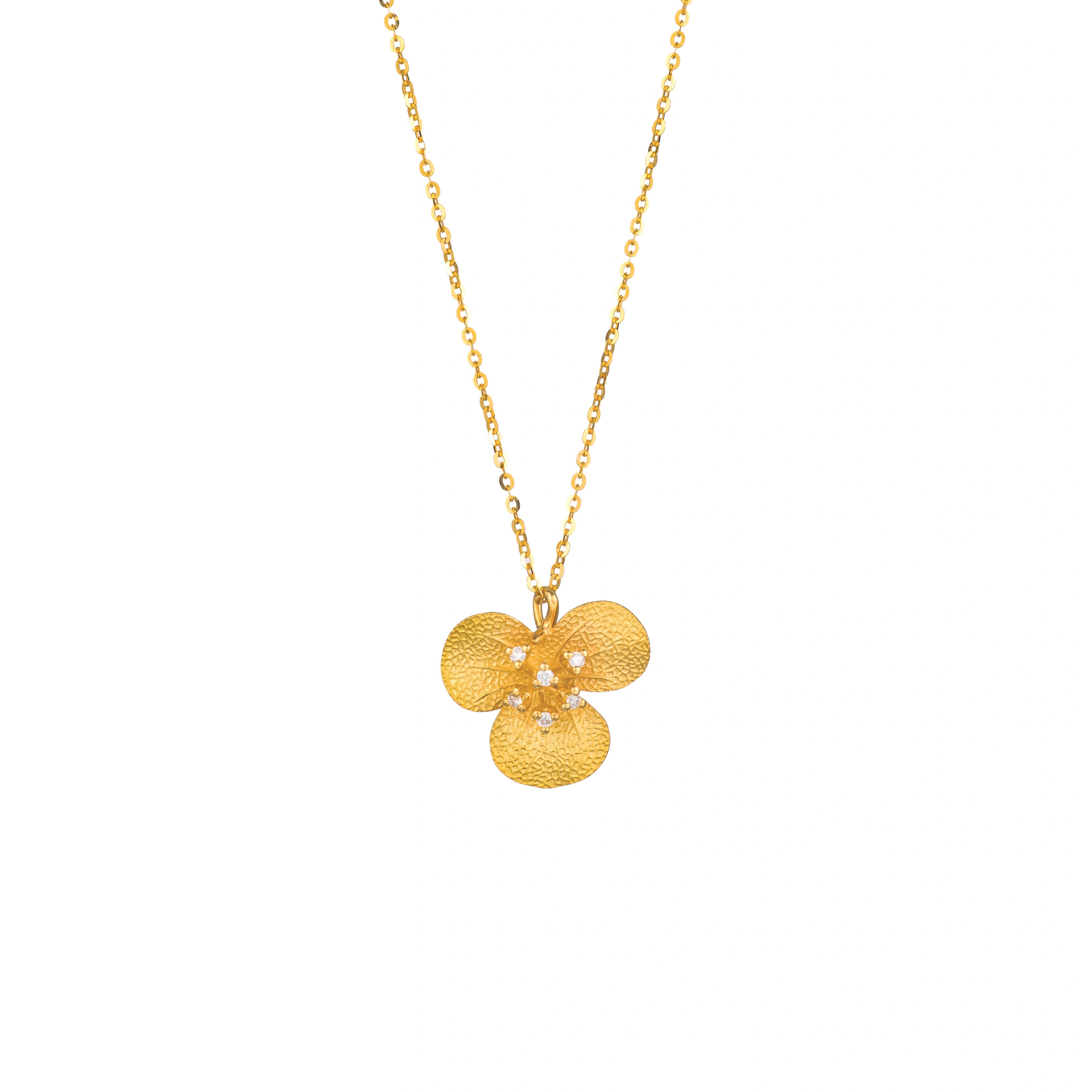 Shop this 18K gold diamond textured floral pendant necklace by LeMing Jewelry, featuring a floral design with 0.053ct diamond accents.