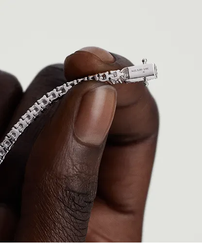 Close-up of the inner tongue and clasp mechanism on a tennis necklace, showing how the LeMing tennis clasp connects.
