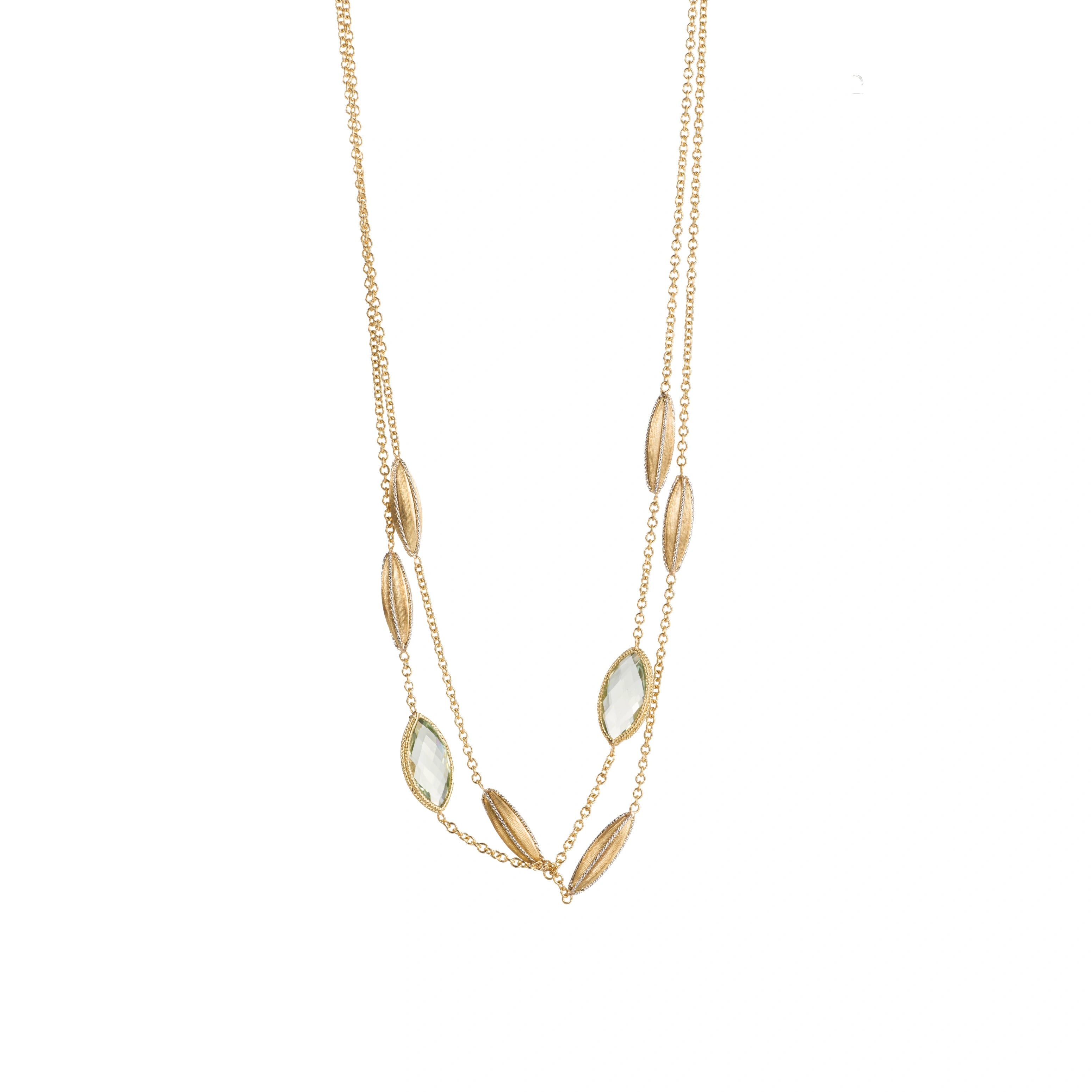 18K gold layered green gemstone necklace with textured leaf details on a white background