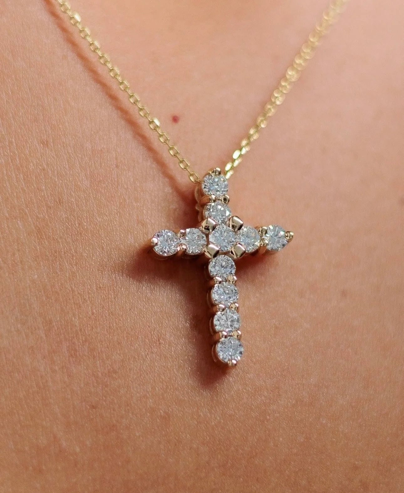 Close-up of diamond cross pendant necklace for LeMing jewelry engraving services