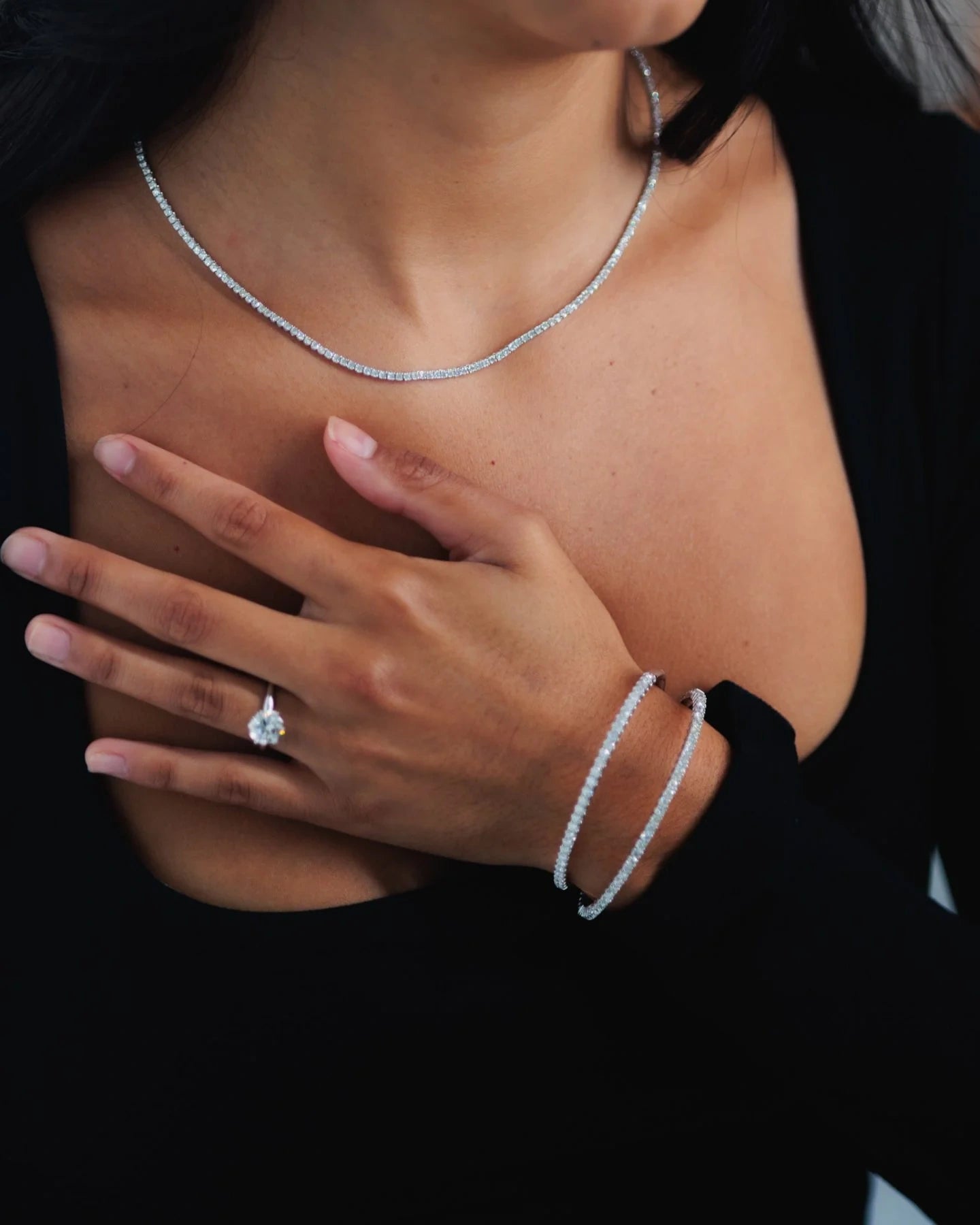 Diamond necklace ring and bracelets worn together for LeMing jewelry polishing service