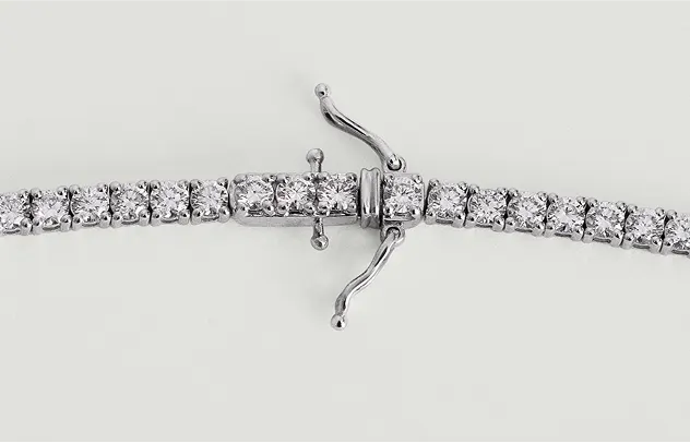 Open tennis necklace clasp with safety arms displayed flat, showing the secure clasp design for a LeMing tennis necklace.