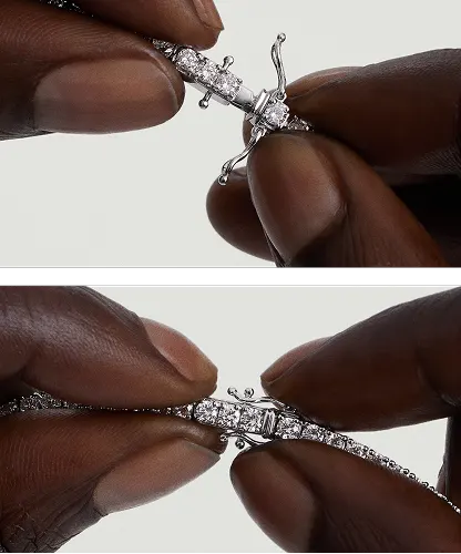 Step-by-step close-up showing how to unclip the safety arms and release the tennis necklace clasp.